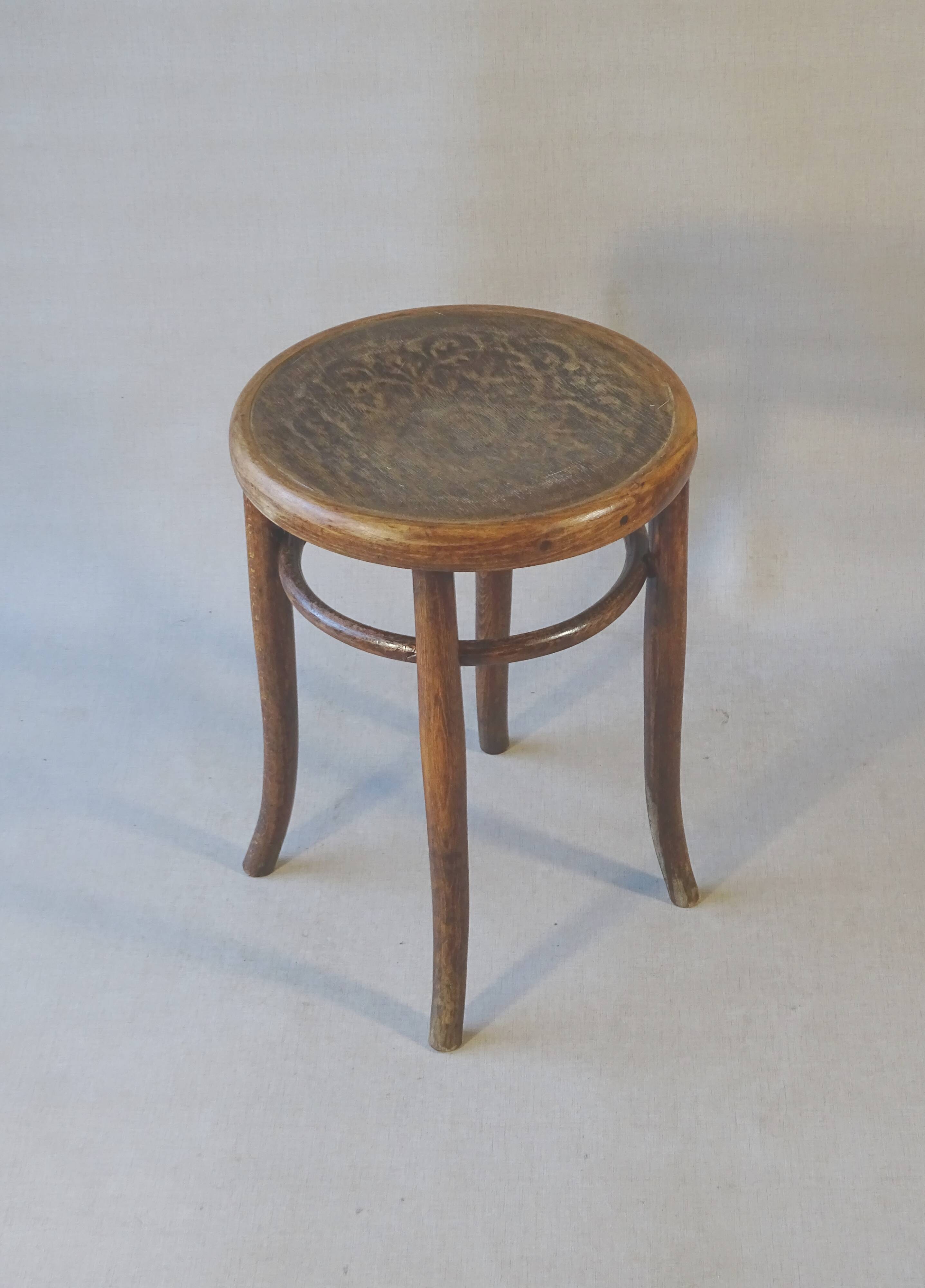 Low stool with wooden seat, circa 1930