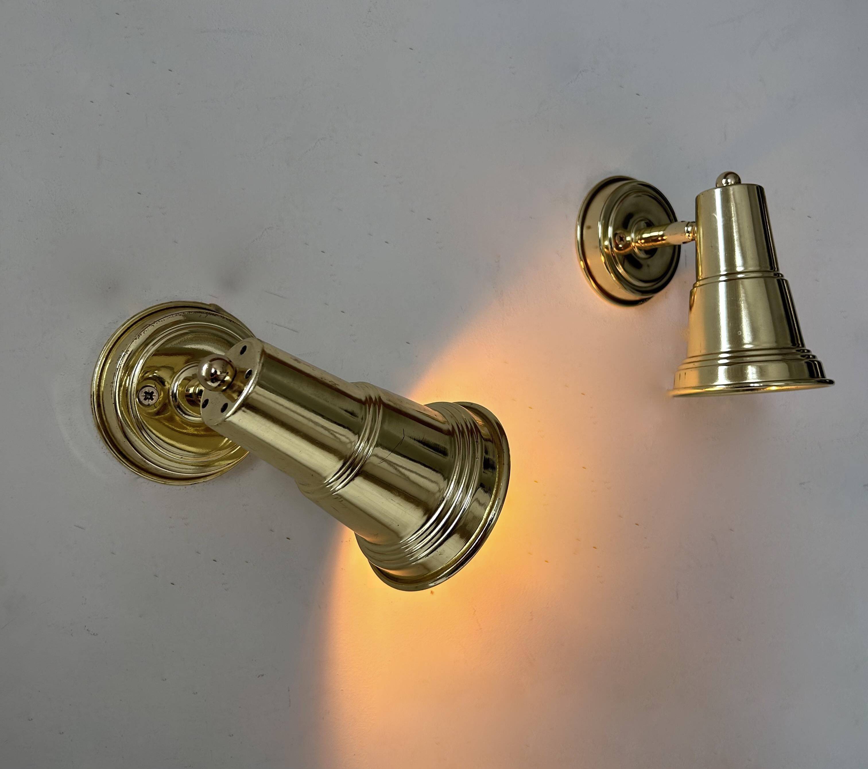 Pair of vintage adjustable wall lights in solid brass, France 1970s