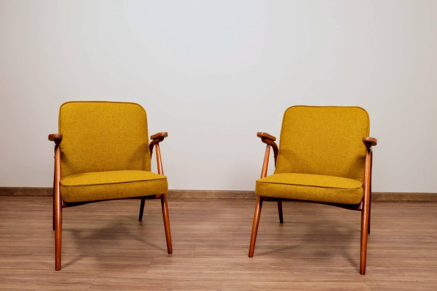 Pair of armchairs in natural wool, gilt, 1960.