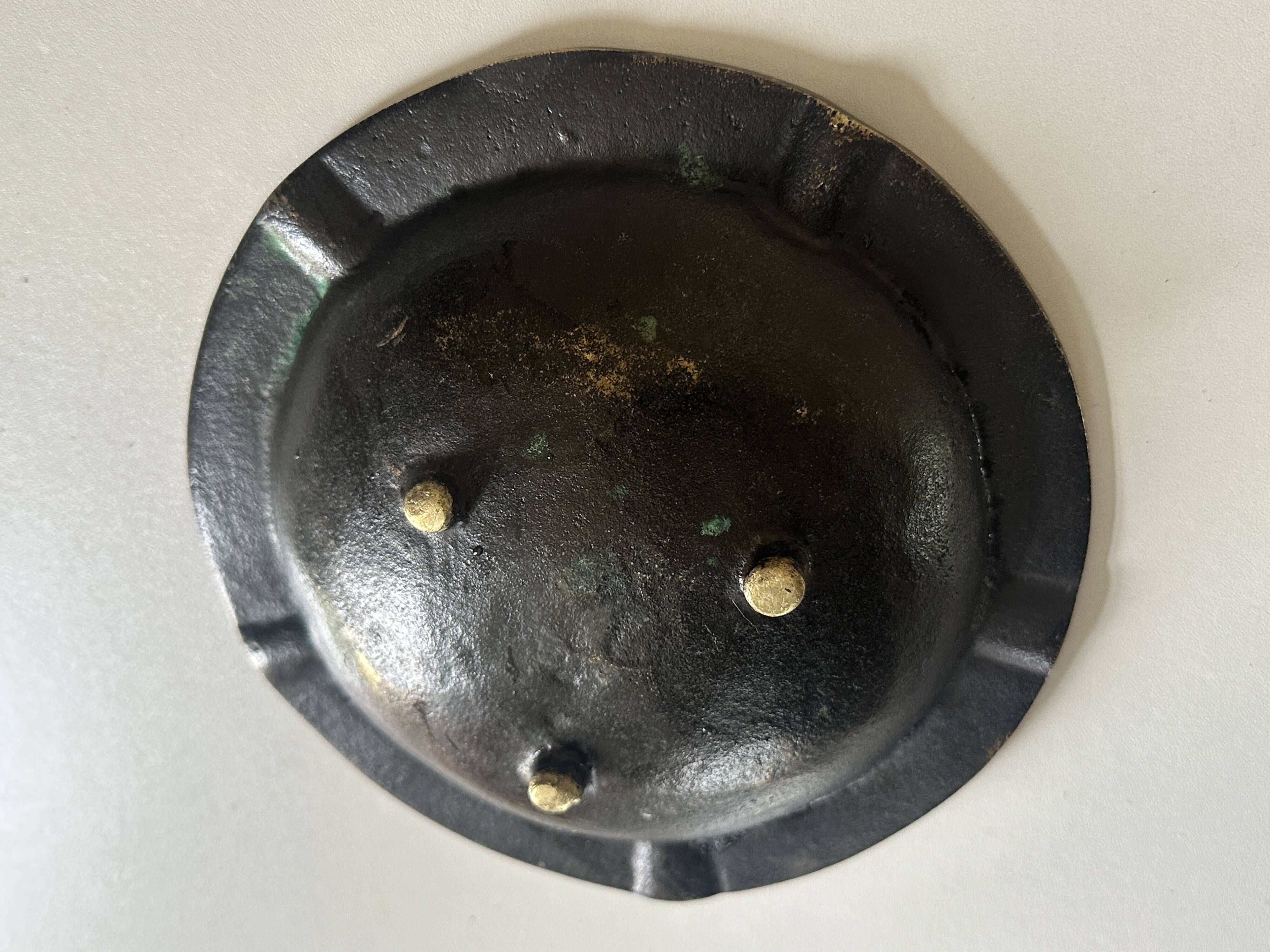 Vintage bronze ashtray design from the 60s