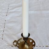 Antique brass rat trap with heart patterns.