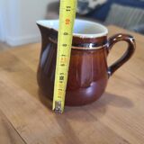 Brown ceramic milk jug