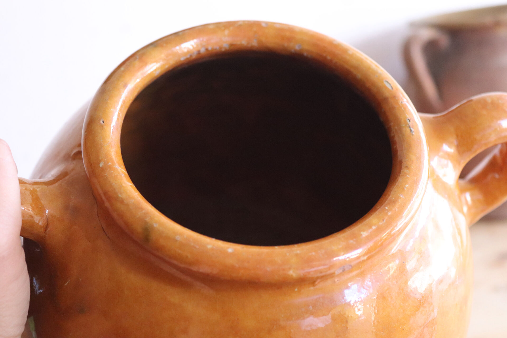Old honey-glazed pot with two handles