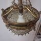 Antique balloon chandelier with pendants, in brass and with mouldings.
