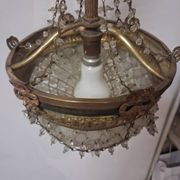 Antique balloon chandelier with pendants, in brass and with mouldings.