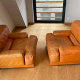 Pair of vintage armchairs Gérard Guermonprez tawny leather and stainless steel, France 1970