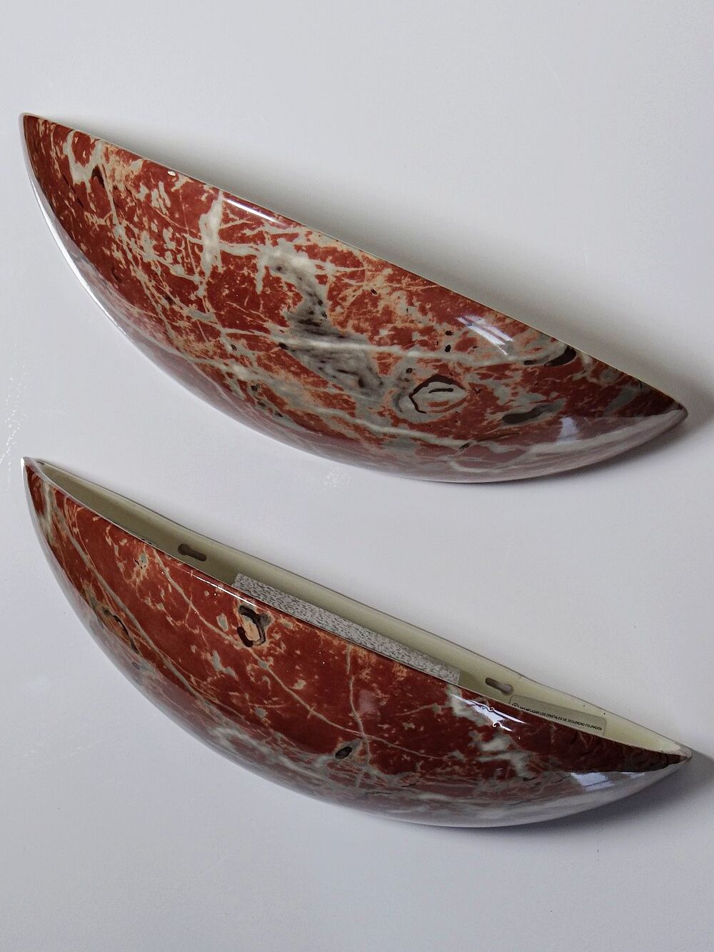 Pair of vintage wall sconces in faux red marble ceramic, 1990s.