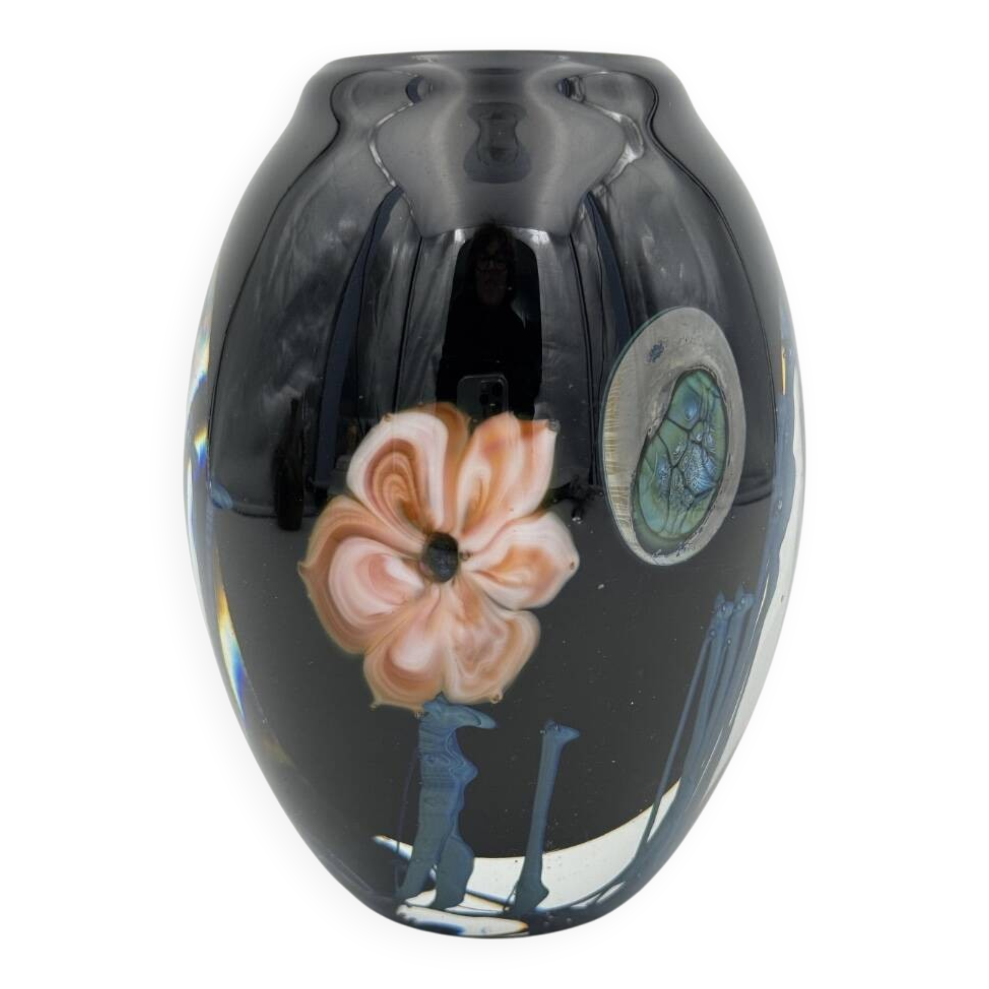 Double-lined blown glass vase with flower inclusions.
