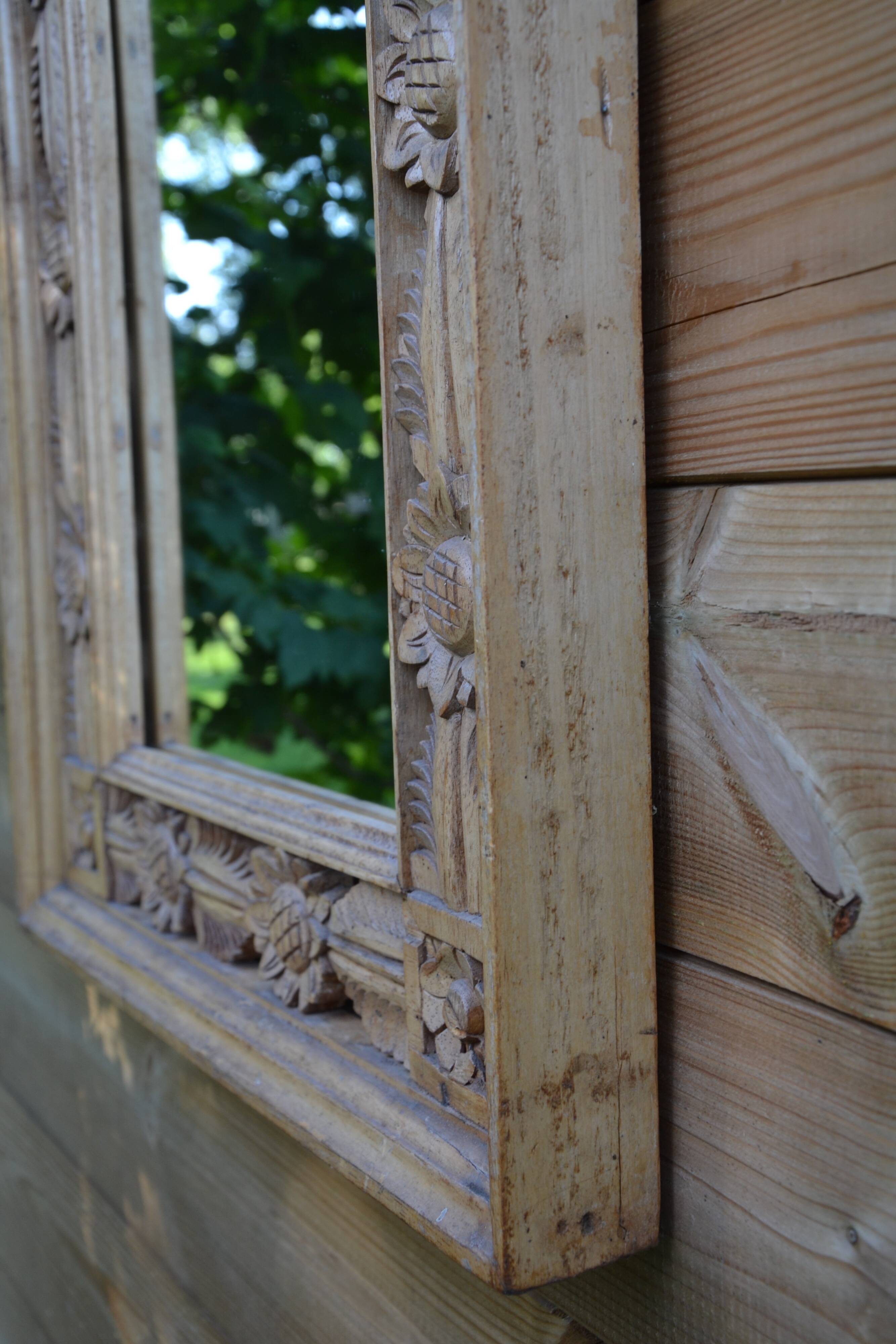 Large carved wooden mirror