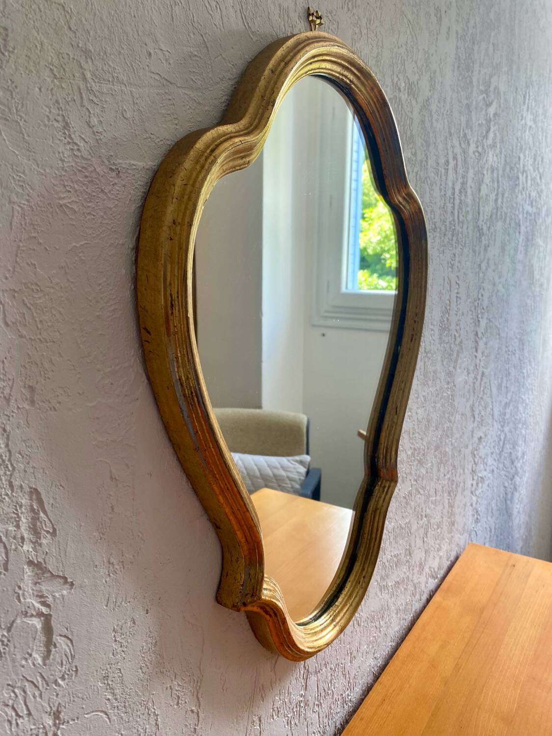 Wall mirror in a gilded wooden frame