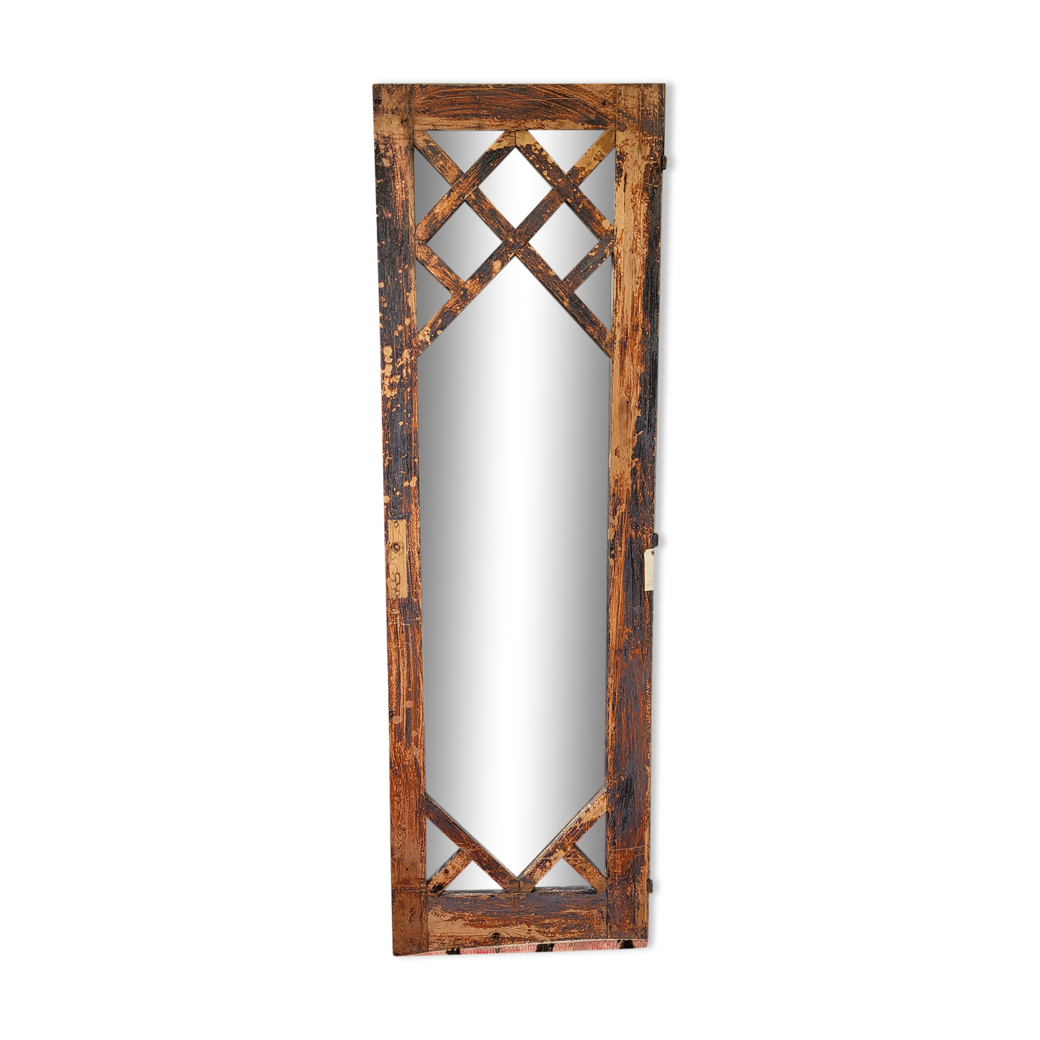 Wooden mirror mounted on old door
