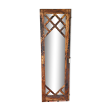 Wooden mirror mounted on old door