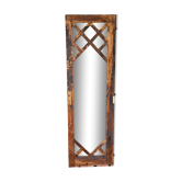 Wooden mirror mounted on old door
