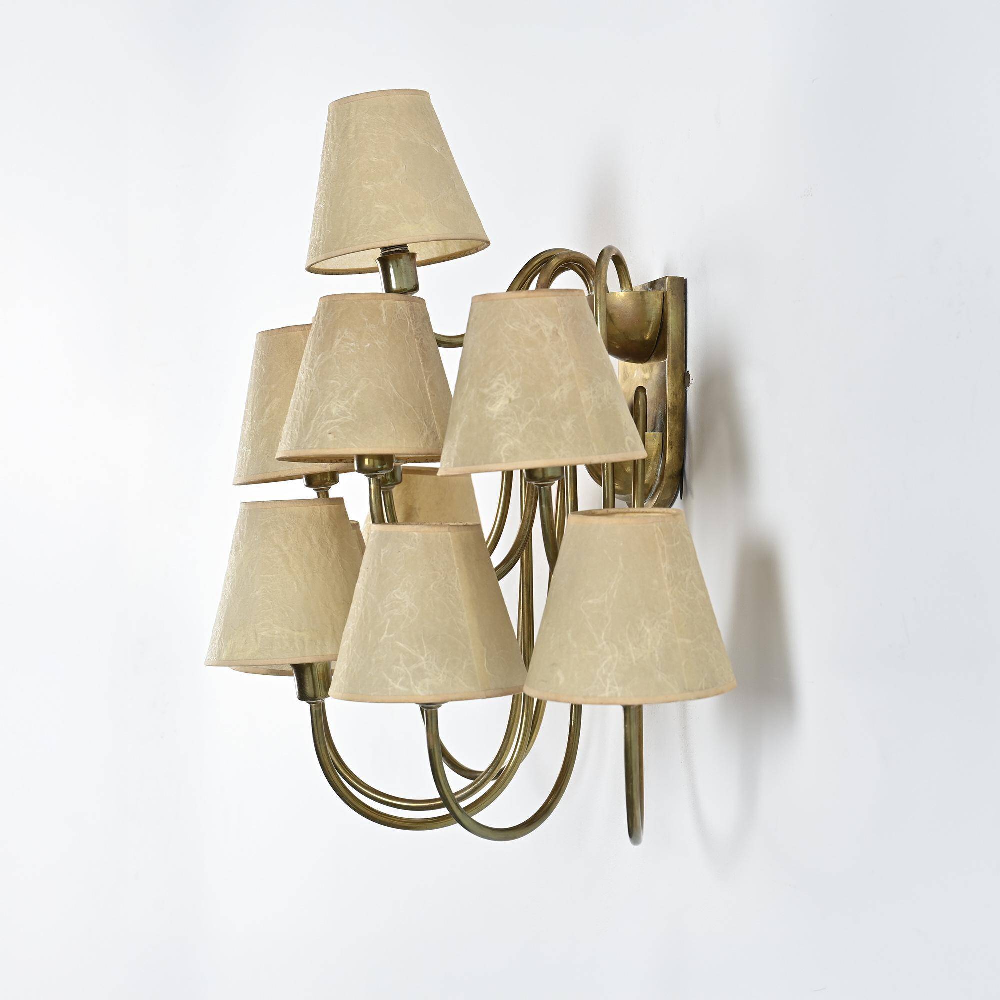 Wall sconce with nine arms in brass, France, circa 1950.