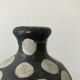 Terracotta vase painted with polka dots