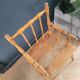 Antique wooden child's armchair from the early 20th century.
