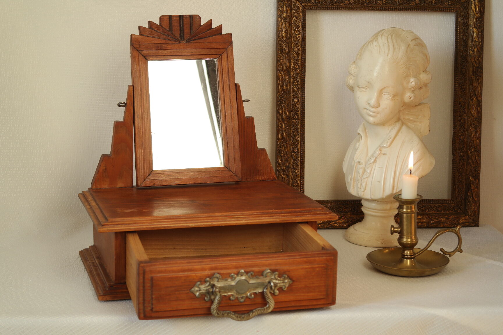 Antique wooden table mirror in Art Deco style.