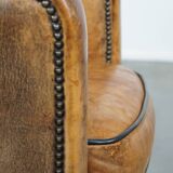 Fauteuil unique en cuir de mouton ancien