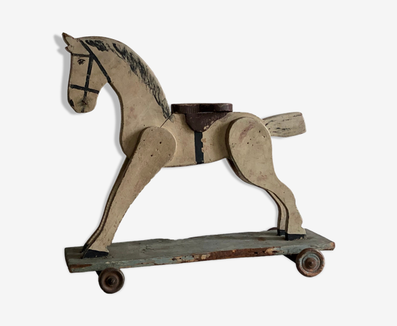 Ancien cheval en bois sur roulettes, jouet ancien