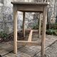 Art Deco farmhouse table made of raw wood.