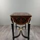 Writing table in Napoléon III style with marquetry and gilded bronzes, 19th century.