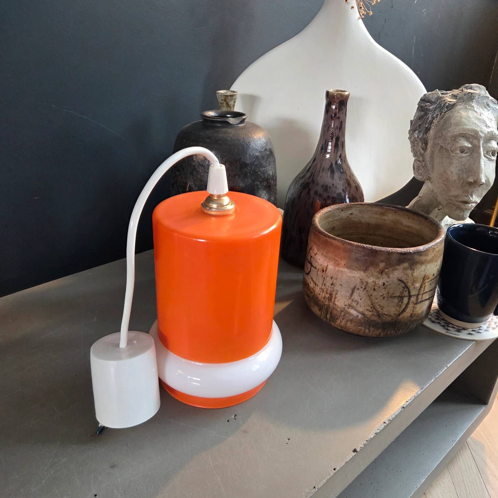 Vintage suspension in orange and white glass.