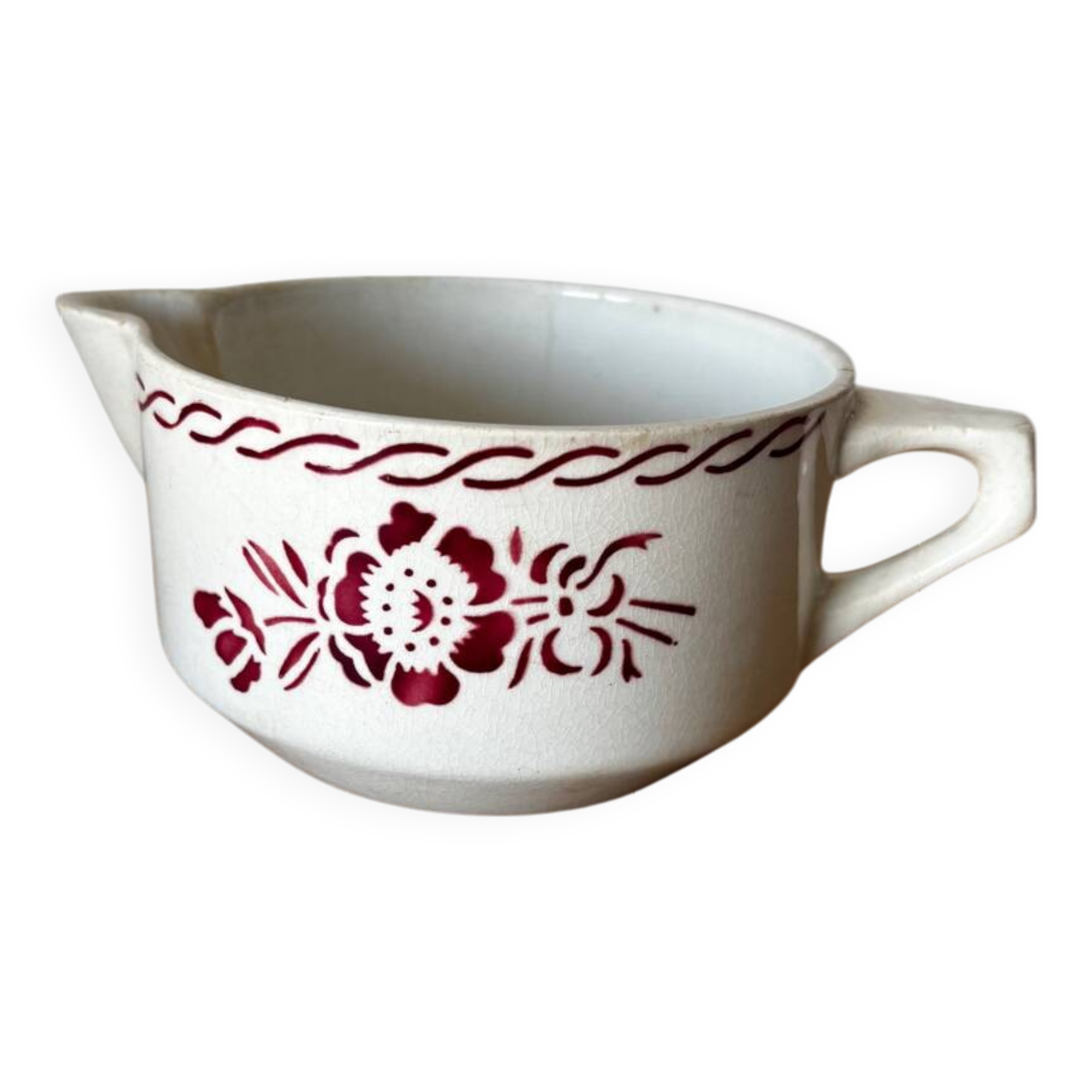 Vintage old sauceboat with pink flowers in St Amand