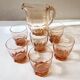 Pitcher and 6 water glasses in pink glass