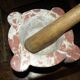 Mortar in veined red marble and its wooden pestle 20th century