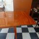 Mid-century vintage coffee table with tapered legs.