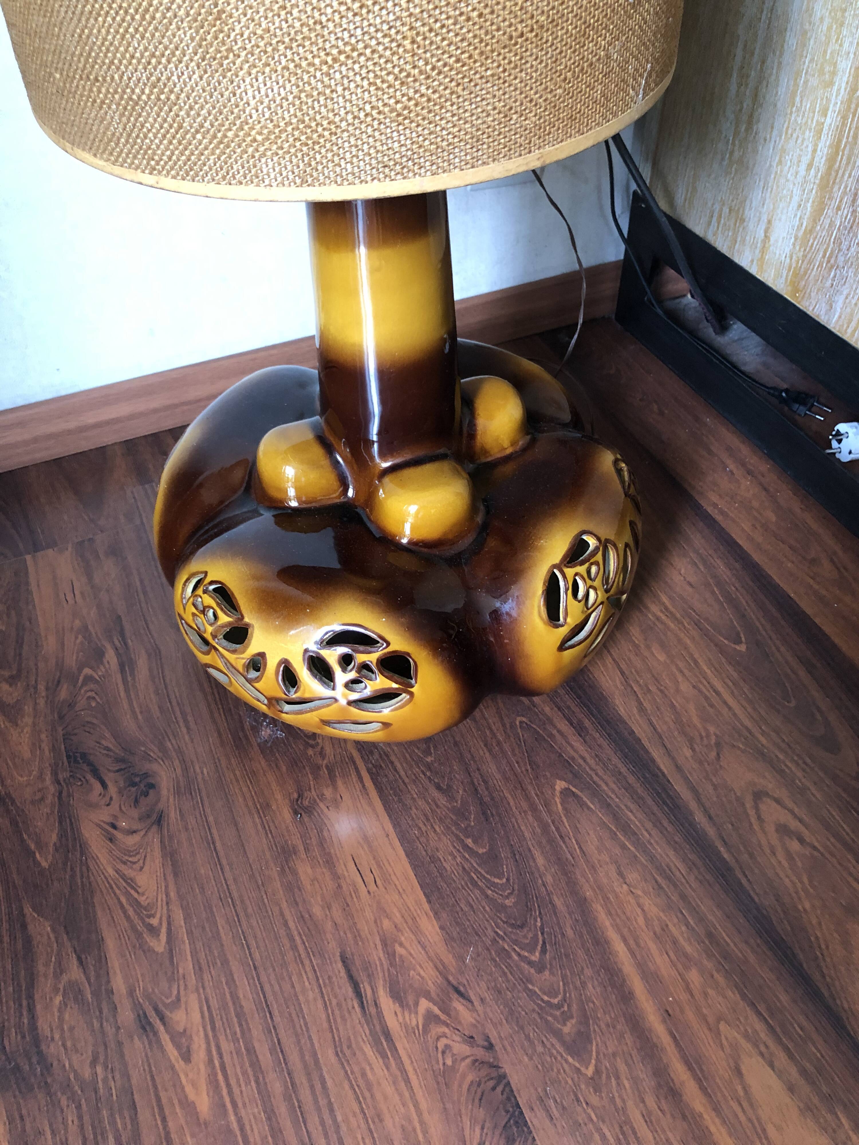 Large vintage ceramic table lamp with rose pattern.