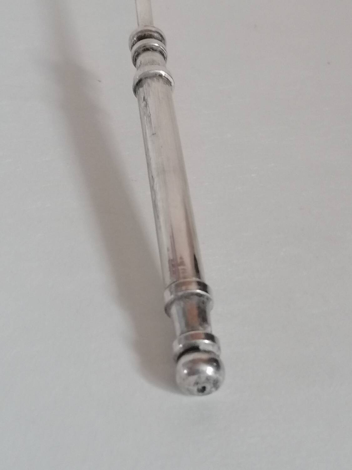 Silver metal candle snuffer