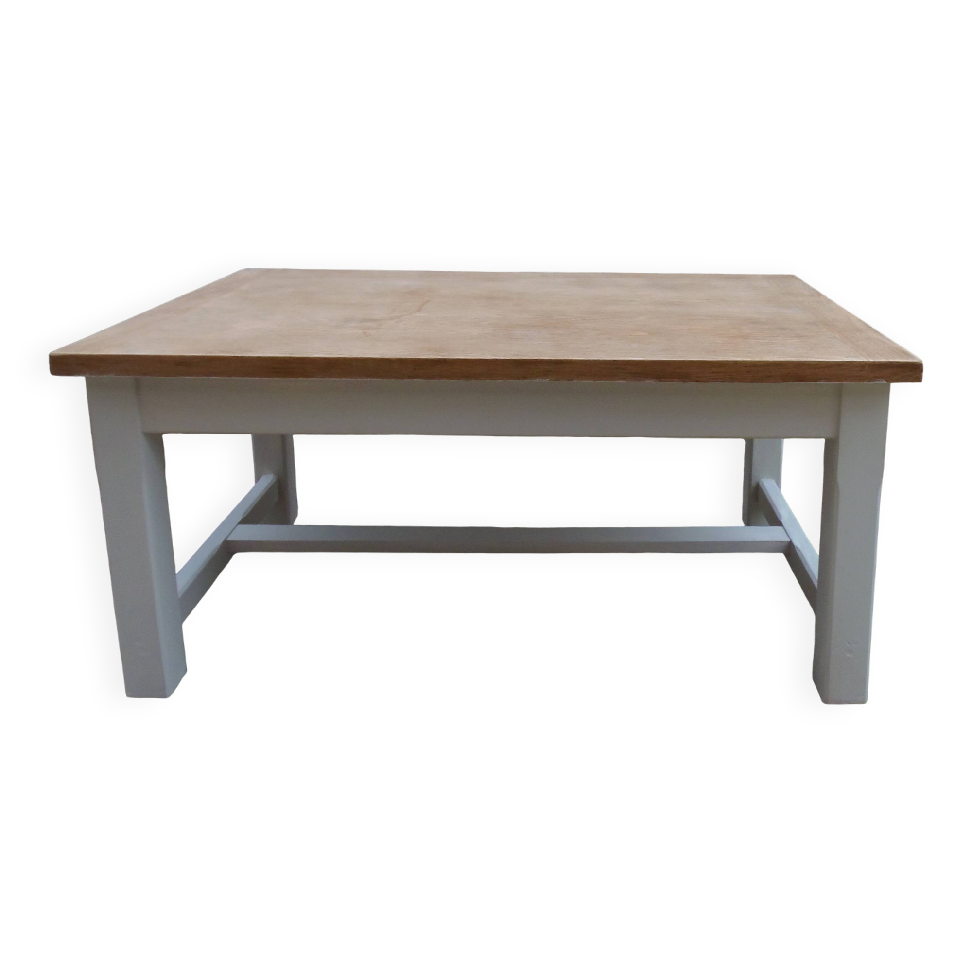 Coffee table with pearl grey legs and a wooden top.
