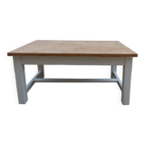Coffee table with pearl grey legs and a wooden top.