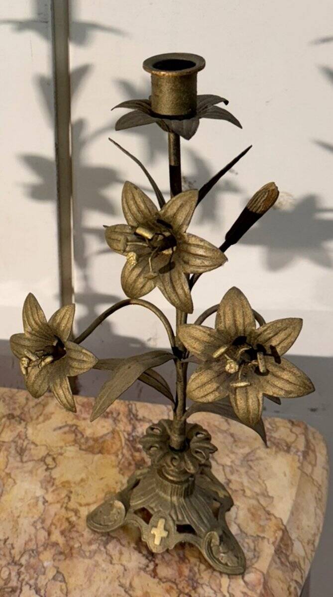 Pair of church candlesticks in bronze with floral decorations.