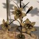 Pair of church candlesticks in bronze with floral decorations.