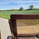 Set of 2 folding chairs in wood and cane.