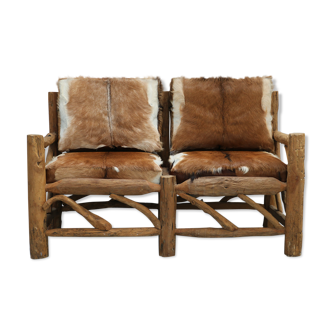 Cottage-style sofa - wood and skins