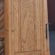 Narrow antique Parisian wardrobe in raw wood