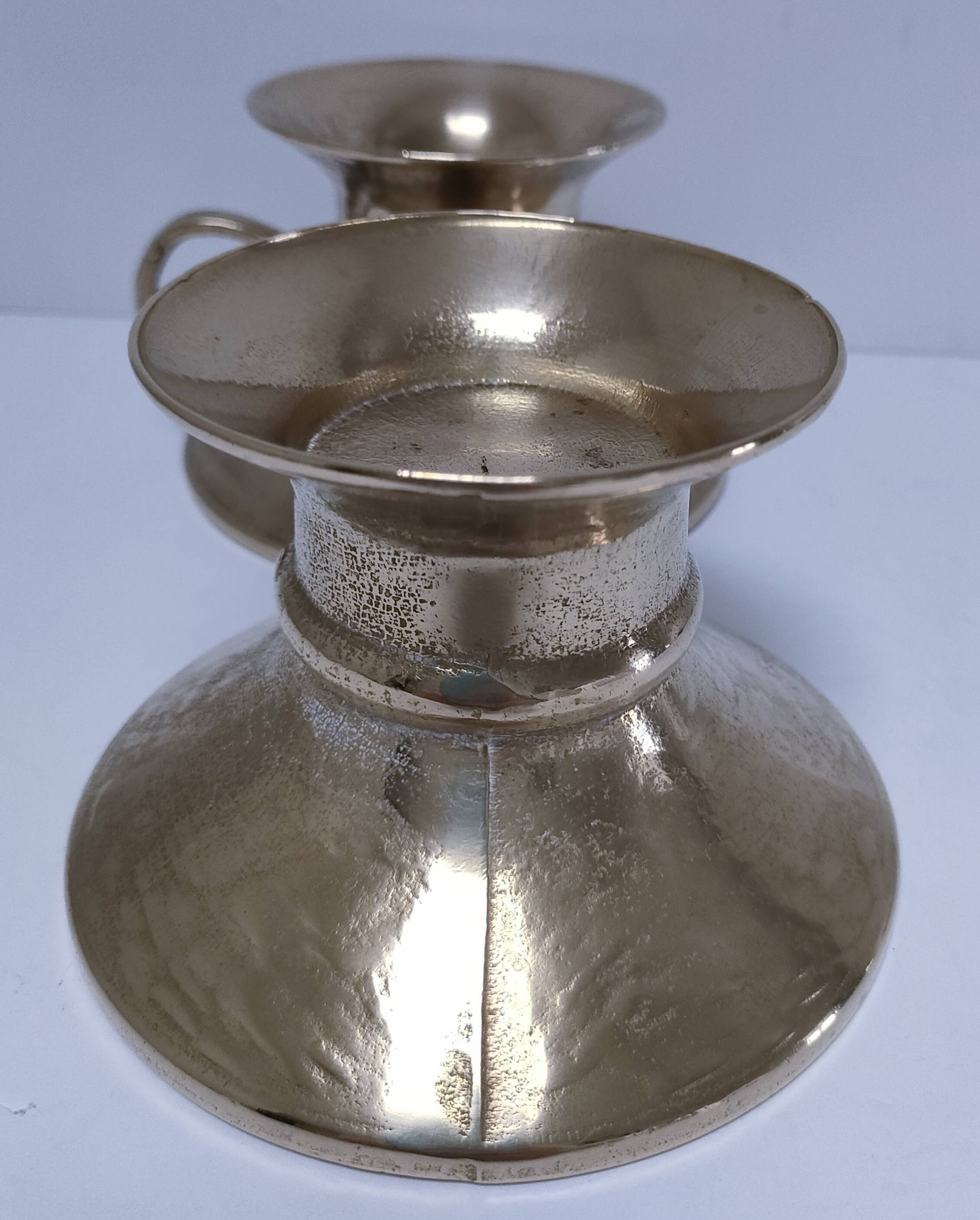 Pair of vintage solid brass hand candlesticks