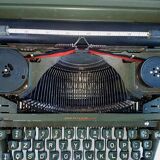 Hermes 2000 portable typewriter with its carrying suitcase