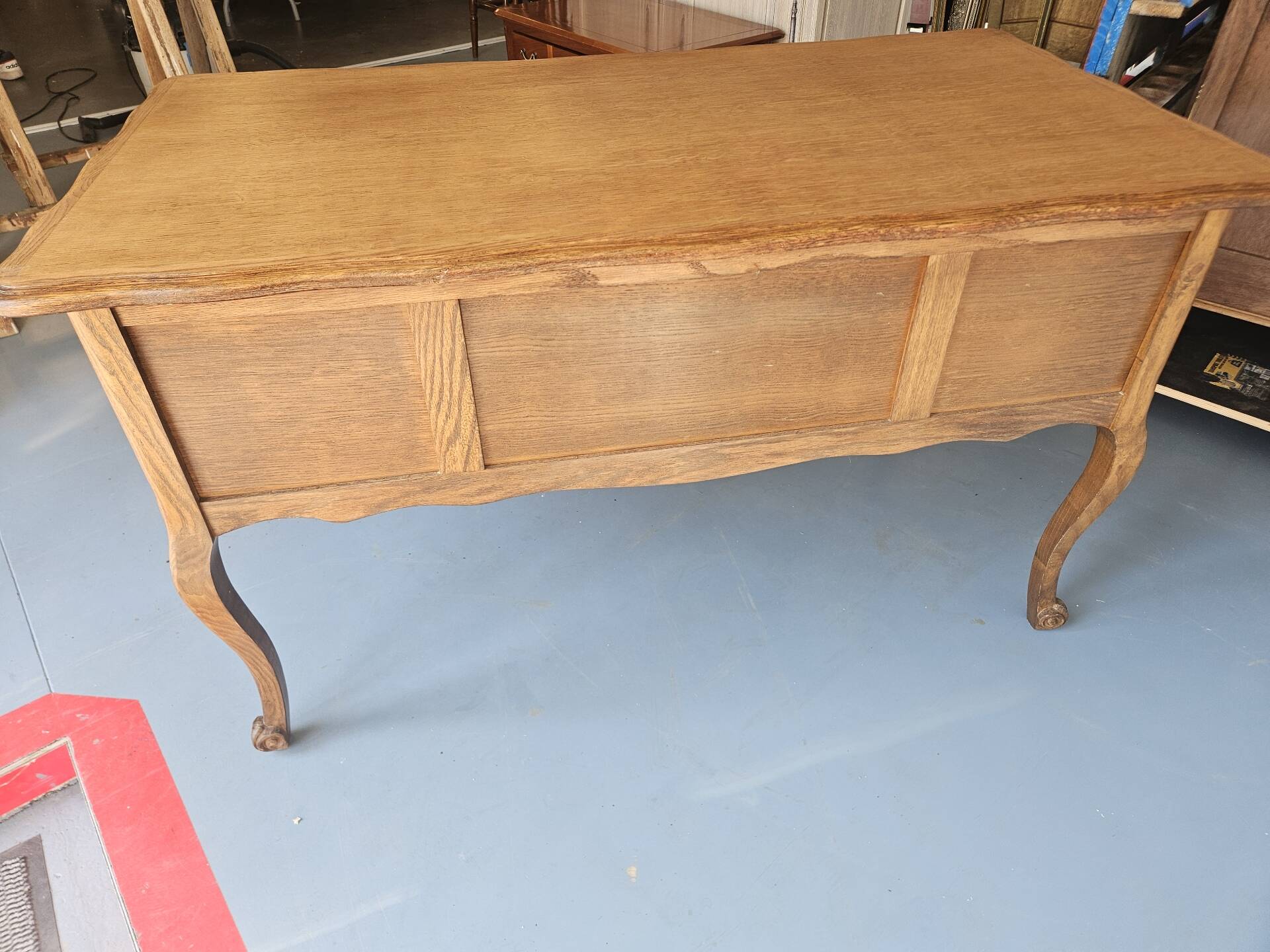 Antique wooden desk with 4 drawers.