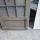Two pairs of solid oak doors with small panes.