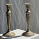 Pair of classic candlesticks in patinated gold metal H25