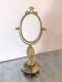 Vintage tabletop mirror in green onyx and gilded brass.