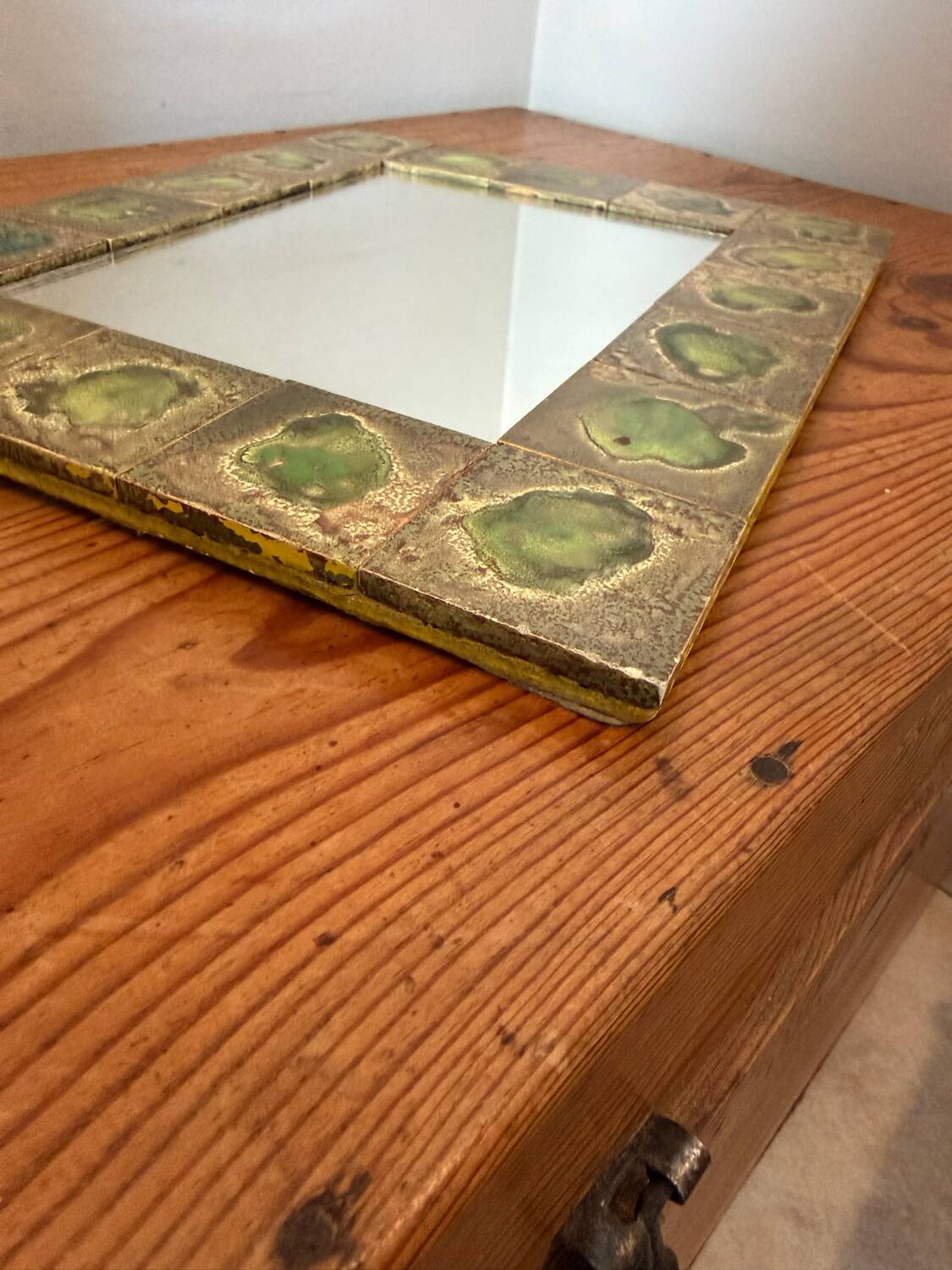 Vintage 1960s green and brown glazed ceramic mirror.