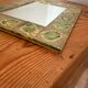 Vintage 1960s green and brown glazed ceramic mirror.