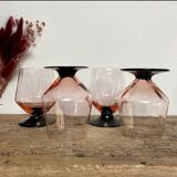 4 pink glasses with black stems