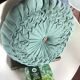 Vintage green hand-pleated round cushion