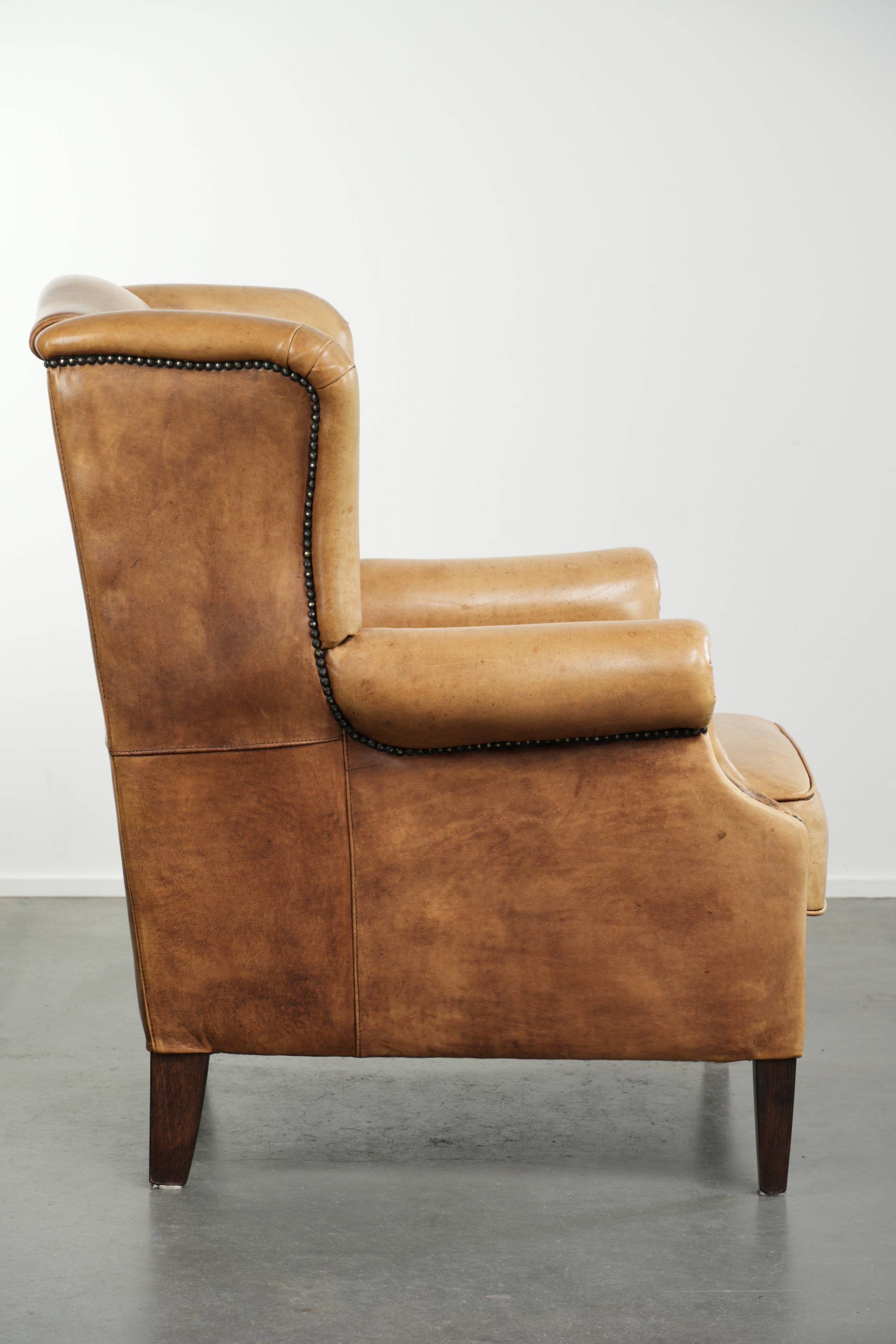 Cow leather wingback armchair with a beautiful timeless English look